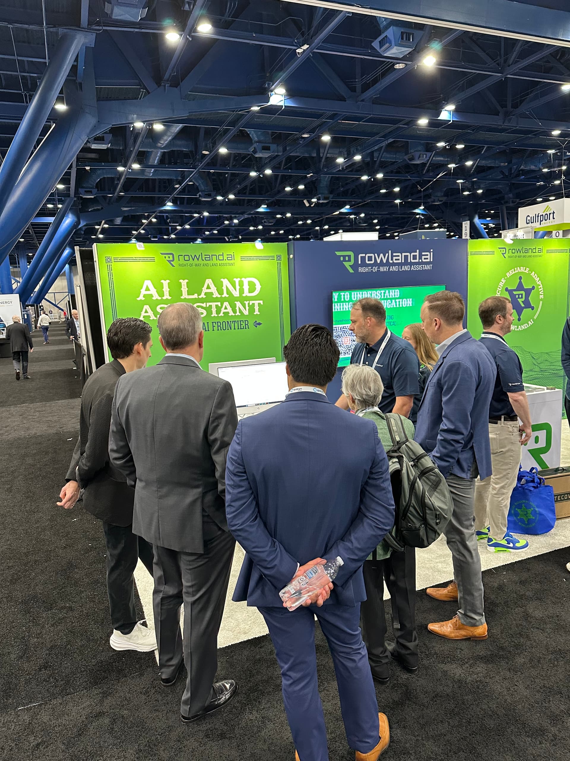 Attendees gather around the Rowland booth at NAPE Summit 2025